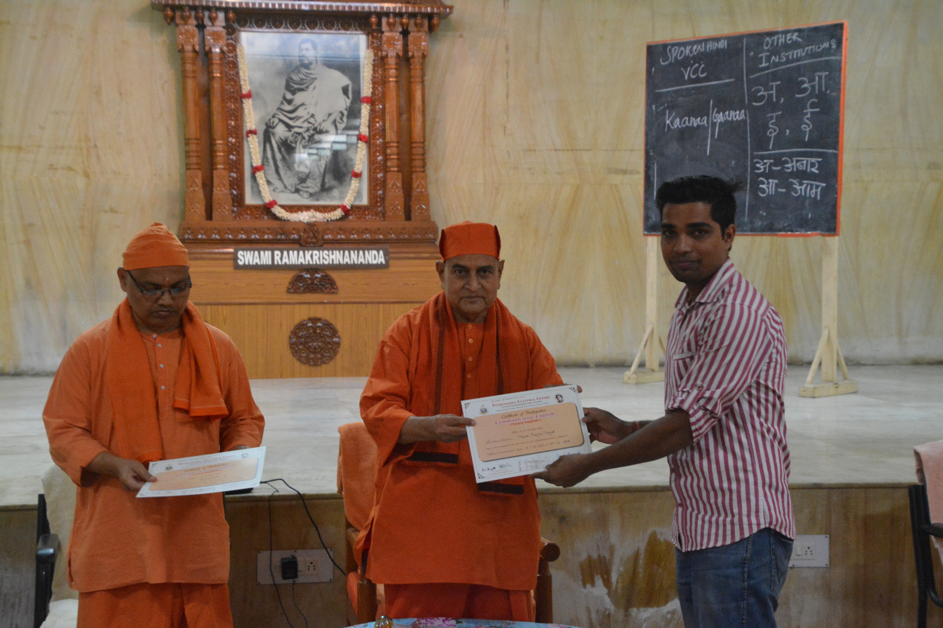 Recognition certificate presentation at Vivekananda Cultural Centre